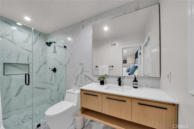 bathroom with vanity, toilet, and walk in shower