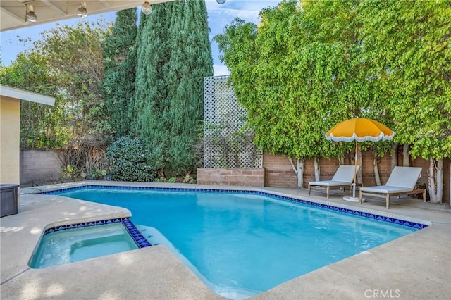 view of swimming pool featuring an in ground hot tub