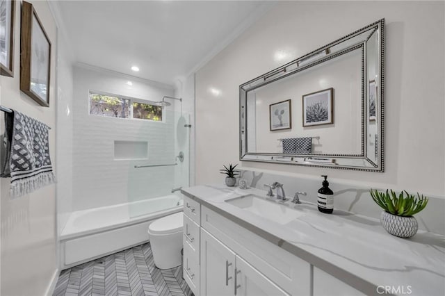 full bathroom with vanity, combined bath / shower with glass door, crown molding, and toilet