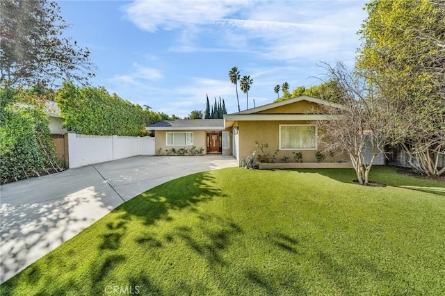 ranch-style house with a front lawn