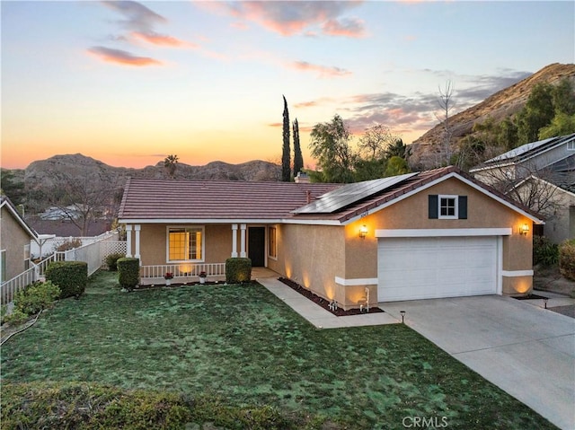 30431 Sunrose Pl, Canyon Country, CA 91387 - view of front facade featuring a porch, stucco siding, a mountain view, solar panels, and a garage