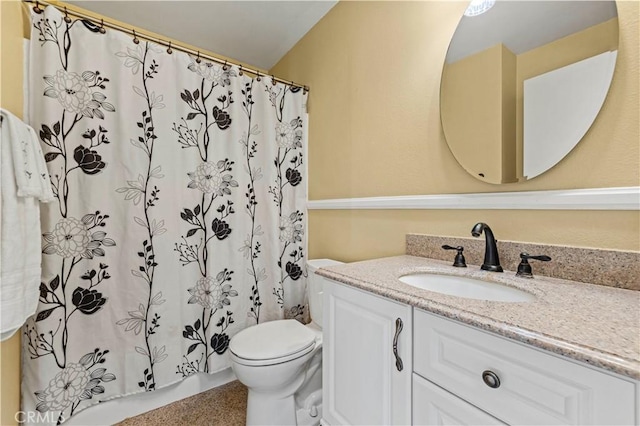 full bath featuring toilet and vanity