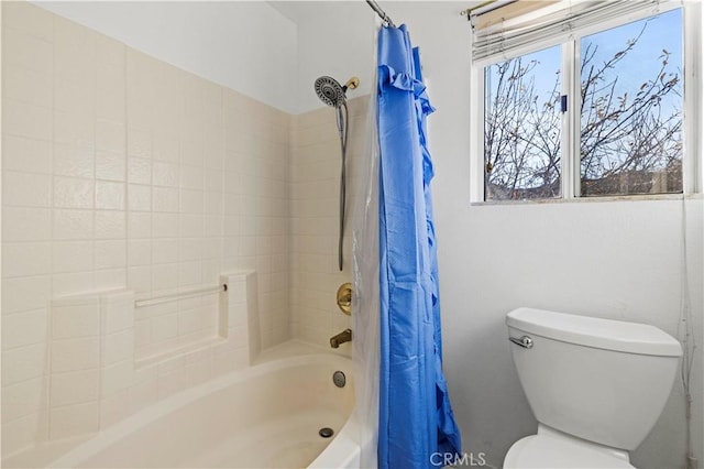 bathroom featuring toilet and shower / bathtub combination with curtain