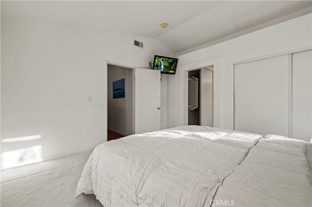 30431 Sunrose Pl, Canyon Country, CA 91387 - bedroom featuring vaulted ceiling and multiple closets