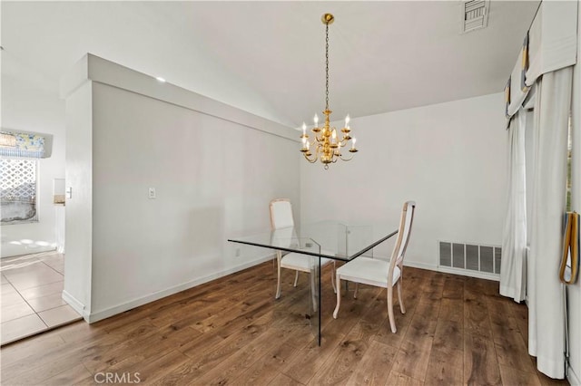 30431 Sunrose Pl, Canyon Country, CA 91387 - dining room featuring a chandelier, lofted ceiling, and hardwood / wood-style floors