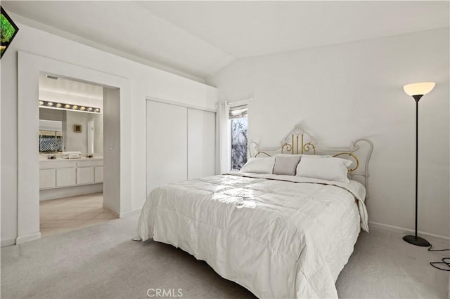 30431 Sunrose Pl, Canyon Country, CA 91387 - bedroom with lofted ceiling, carpet flooring, ensuite bathroom, a closet, and tile patterned floors