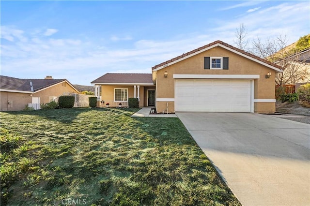 ranch-style house with driveway, a front yard, a garage, and stucco siding