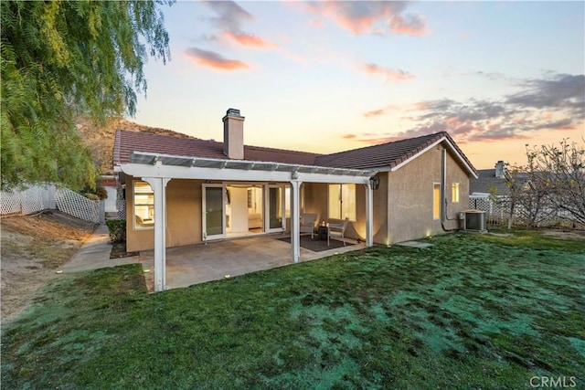 back of property featuring a yard, a patio, stucco siding, fence, and cooling unit