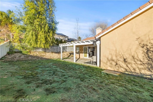 view of yard featuring a patio area, a fenced backyard, and a pergola