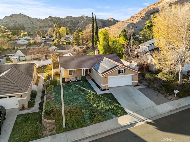 birds eye view of property with a residential view and a mountain view