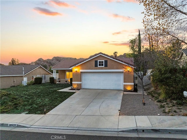 30431 Sunrose Pl, Canyon Country, CA 91387 - view of front facade with concrete driveway, a garage, stucco siding, a lawn, and a tile roof