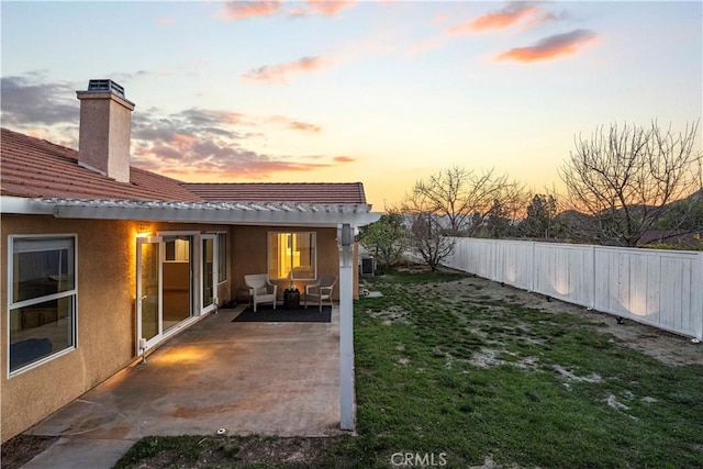 view of yard with fence and a patio