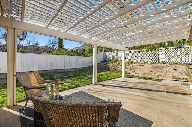 view of patio / terrace with a fenced backyard and a pergola