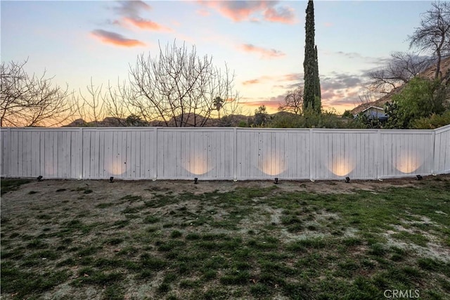 yard at dusk with fence