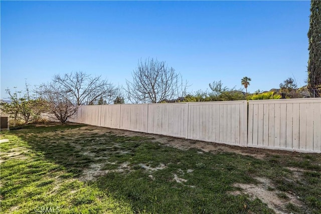 view of yard with a fenced backyard