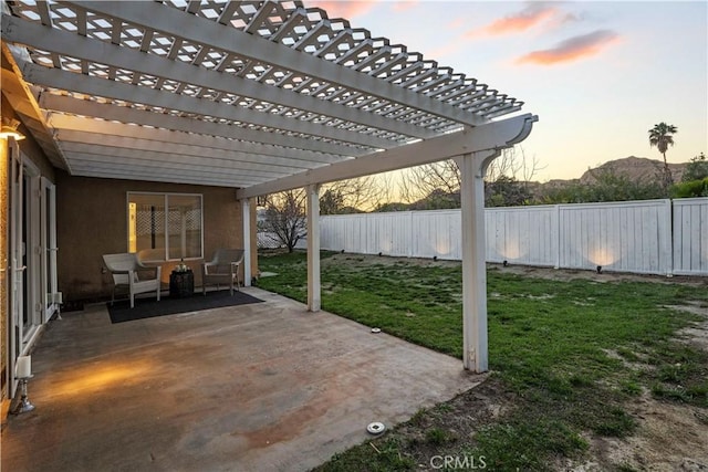 view of patio with a fenced backyard and a pergola