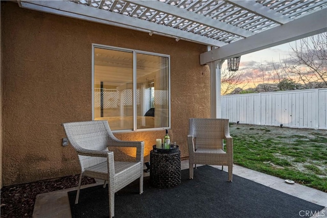 view of patio / terrace featuring fence and a pergola