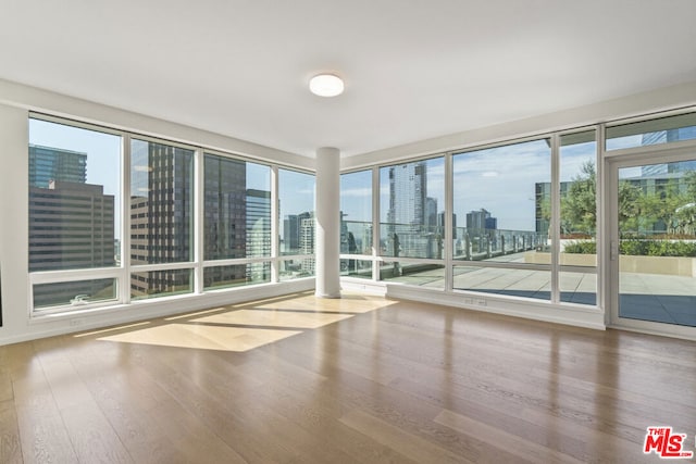 unfurnished sunroom featuring plenty of natural light