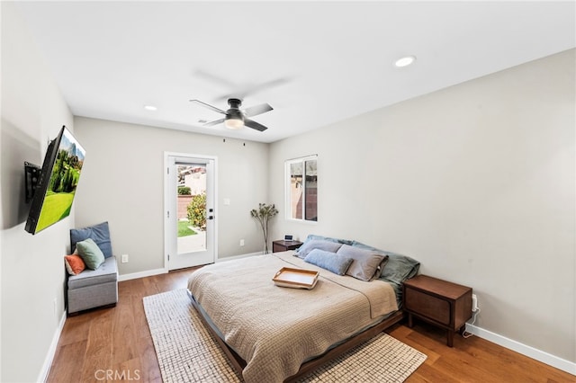 bedroom featuring ceiling fan, hardwood / wood-style floors, and access to outside