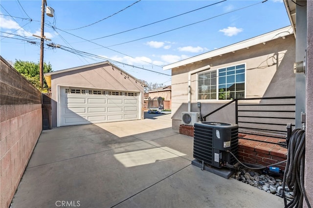 garage with ac unit and central air condition unit