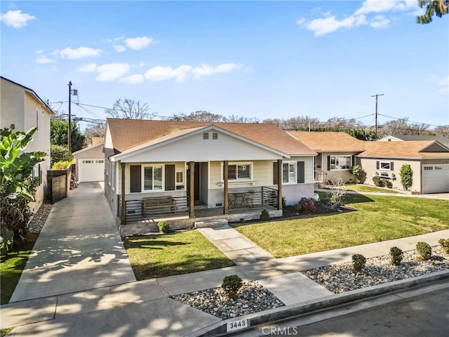 ranch-style house featuring a garage, a front yard, and covered porch