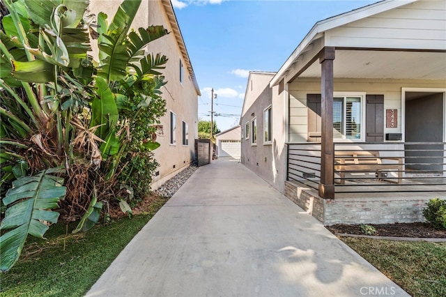 view of home's exterior with a garage and an outdoor structure