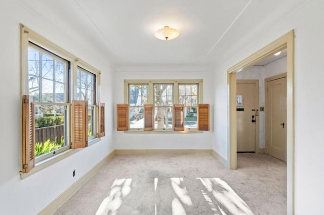 unfurnished sunroom featuring a wealth of natural light