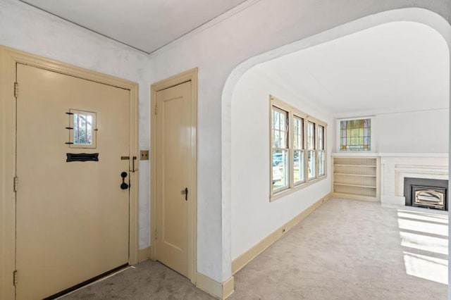 entrance foyer featuring light carpet