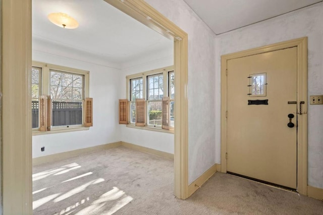 view of carpeted foyer