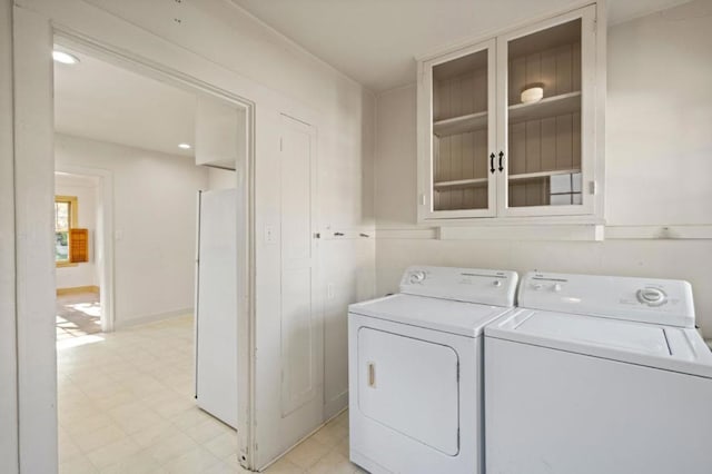 laundry room featuring separate washer and dryer