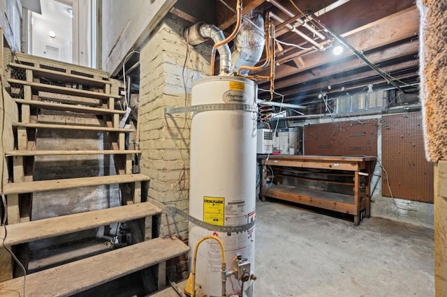 basement with a workshop area and water heater