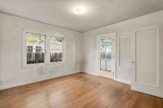 empty room with hardwood / wood-style flooring