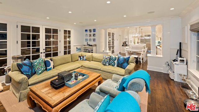 living room featuring crown molding, dark hardwood / wood-style floors, and french doors