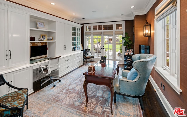 office space featuring hardwood / wood-style floors, built in desk, french doors, and plenty of natural light