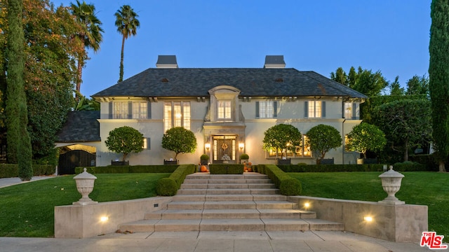 view of front of home with a yard