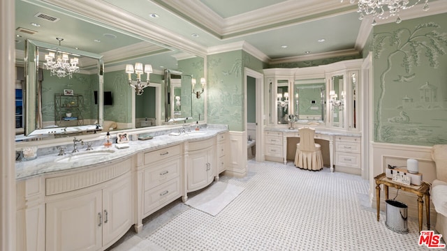 bathroom with crown molding, vanity, toilet, and a notable chandelier