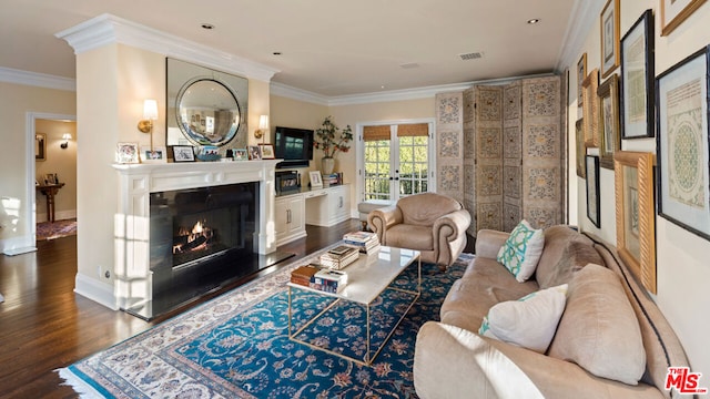 living room featuring dark wood-type flooring, ornamental molding, and french doors