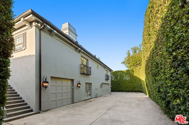 view of property exterior featuring a garage