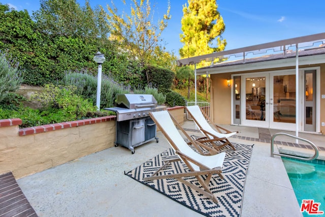 view of patio / terrace with grilling area and french doors