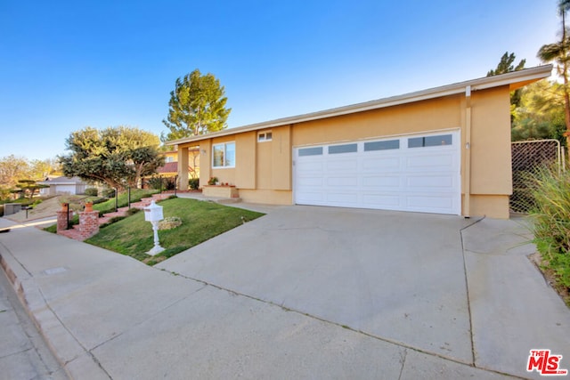 single story home with a garage