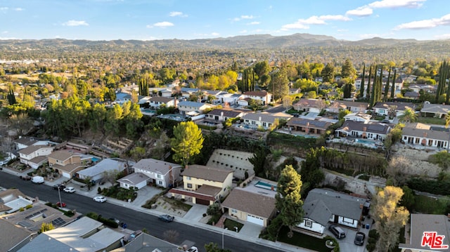 birds eye view of property featuring a mountain view