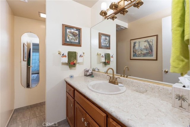 bathroom featuring vanity and tile patterned flooring