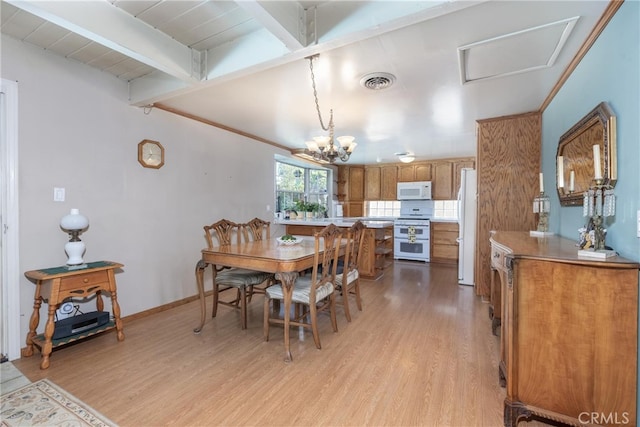 dining room with light wood-type flooring, a notable chandelier, and beam ceiling