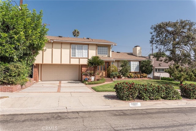 view of front of property with a garage