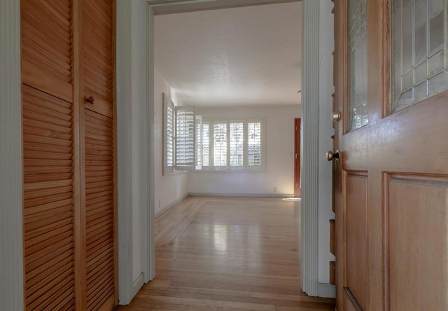 hallway with light wood-type flooring