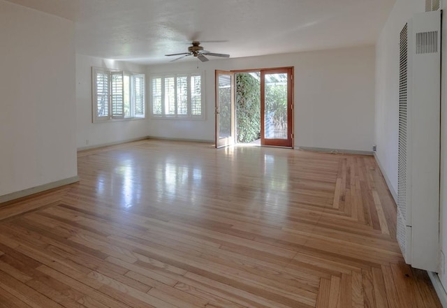 unfurnished room with ceiling fan