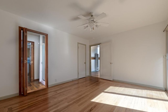 spare room with ceiling fan and light hardwood / wood-style floors