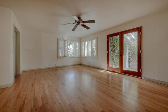 empty room featuring ceiling fan and light hardwood / wood-style flooring