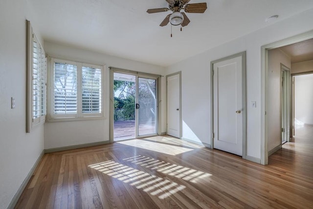 interior space with light hardwood / wood-style floors and ceiling fan