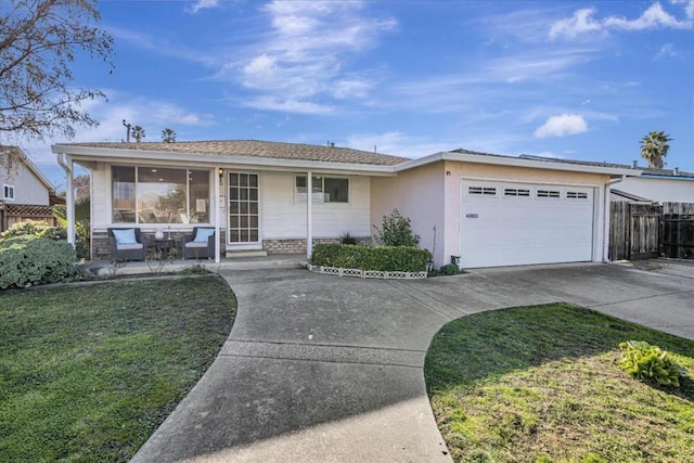 ranch-style house with a garage and a front yard